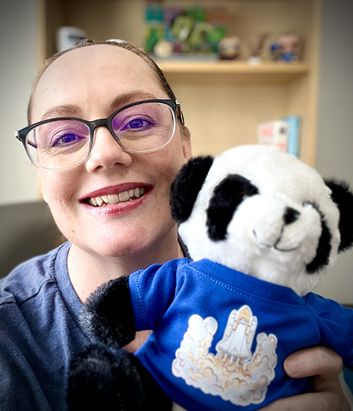 Cheryl and a plush toy panda