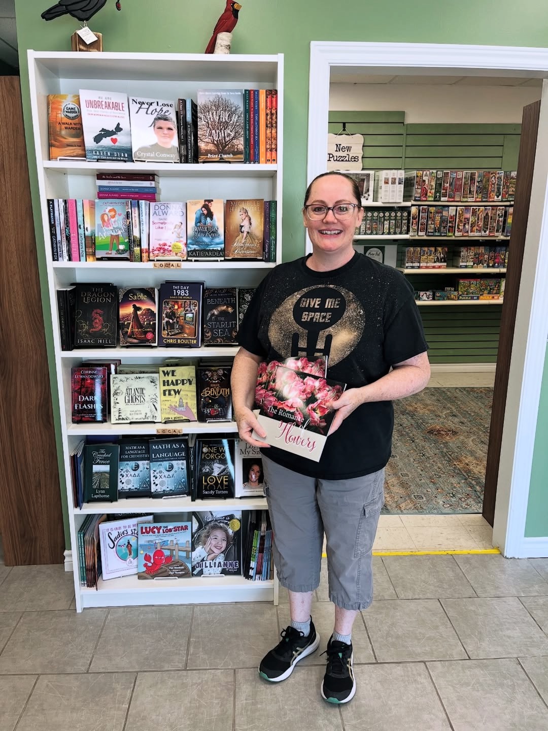Cheryl at Pages and Pieces bookstore with her book, The Romance of Flowers.